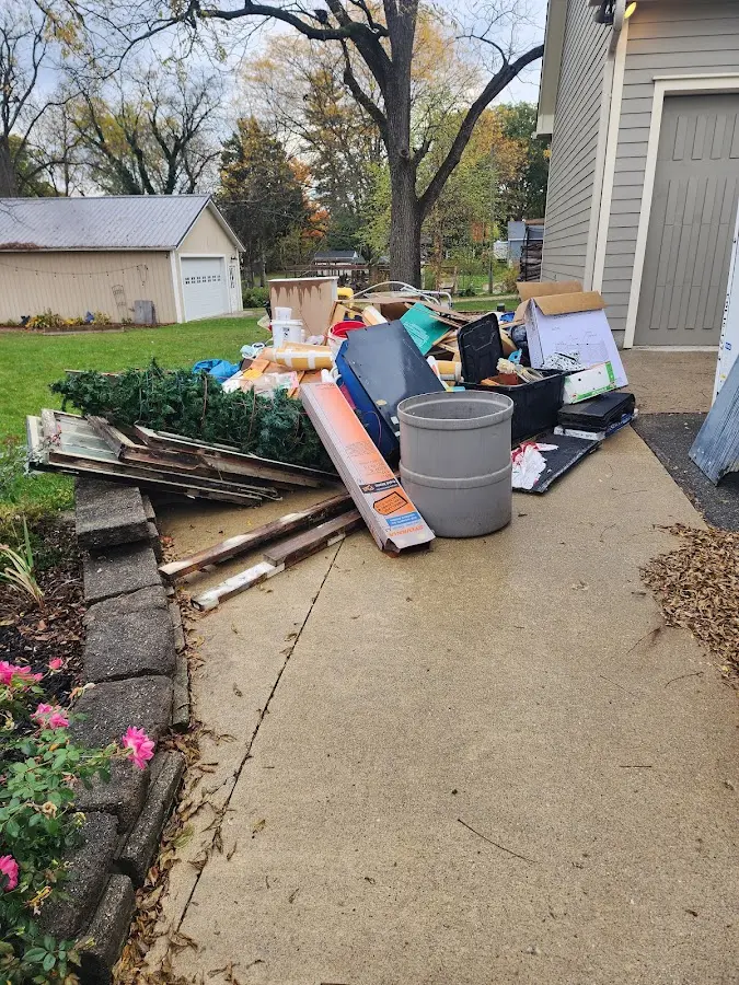 Dumpster being loaded with debris for Commercial Dumpster Rental in Montgomery